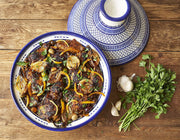 Villa Jerada - Kefta Rub - 50g enhances Moroccan-style chicken tagine with fragrant spices, featuring olives, preserved lemon, and parsley in a traditional tagine dish.