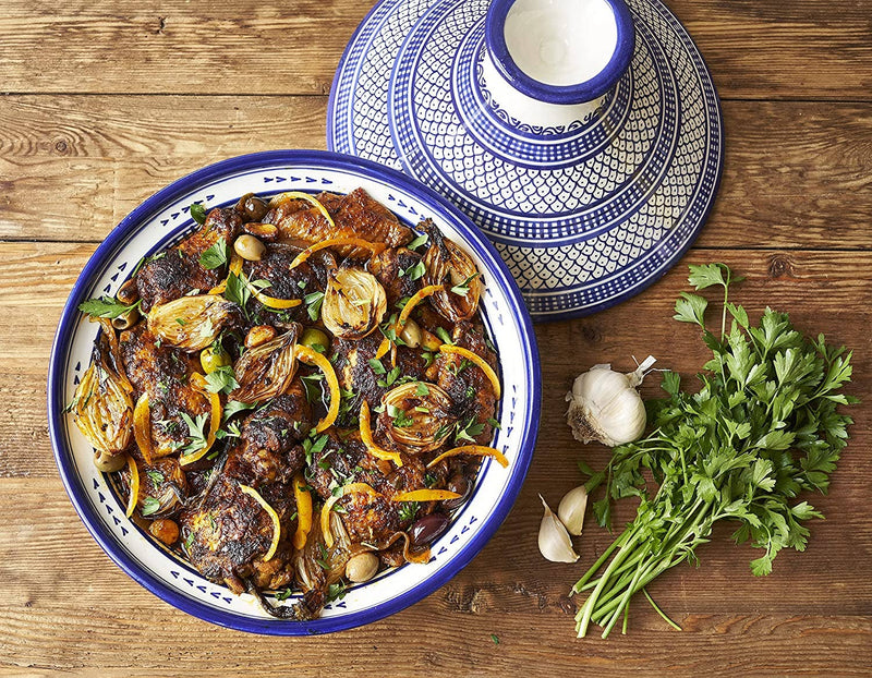 Villa Jerada - Kefta Rub - 50g enhances Moroccan-style chicken tagine with fragrant spices, featuring olives, preserved lemon, and parsley in a traditional tagine dish.