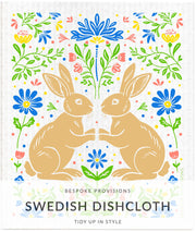Bespoke Provisions - Rabbits Swedish Dishcloth featuring an illustration of rabbits and flowers, ideal for eco-friendly cleaning and gifting.
