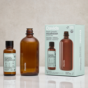 Davids Hydroxi™ fresh mint mouthwash refill kit includes a concentrate bottle and reusable glass bottle, offering 96 uses with natural ingredients for enamel health.