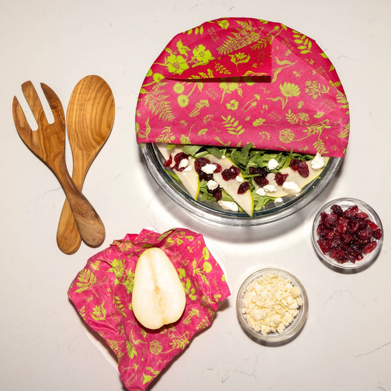 Bee's Wrap - Assorted 3 Pack - Splendid Spring, reusable food storage wraps displayed with a bowl of salad, cranberries, and a wooden spoon.