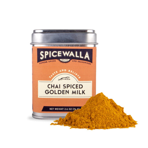 Spicewalla | Chai Spiced Golden Milk tin with a mound of bright yellow-orange powder, blending chai and golden milk spices for a flavorful beverage.