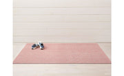 Chilewich Heathered Shag Mats - Blush, 18 x 28, displayed on a pink mat, showcasing its durable and stain-resistant texture suitable for various home spaces.