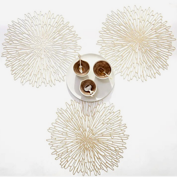 Chilewich | Bloom Placemats - Champagne featuring an intricate floral-inspired design, elegantly displayed with cups and spoons, highlighting its sophisticated dining enhancement.