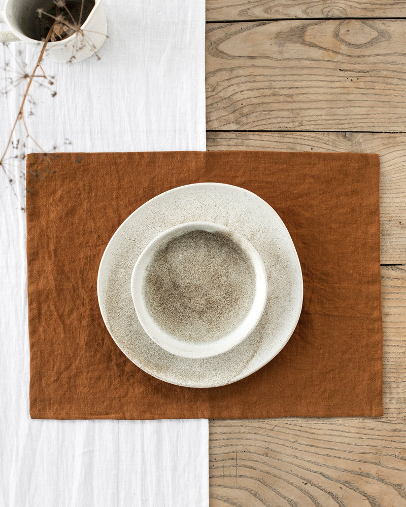 MagicLinen cinnamon linen placemat with a ceramic plate and bowl