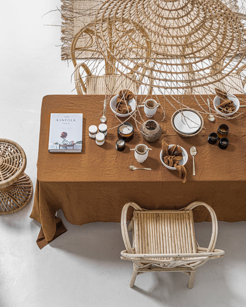 MagicLinen tablecloth, 59x98 inches, ideal for enhancing dining settings with its contemporary seam finish, suitable for both casual and formal occasions.