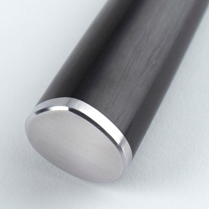 Close-up of Shun Classic Boning & Fillet knife, showcasing a cylindrical handle with a polished stainless-steel cap, highlighting its precision and craftsmanship for kitchen use.