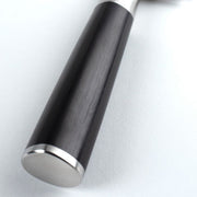 Shun Classic Nakiri Ebony, 6.5 inches knife with a dark wooden handle and metal cap, ideal for precise vegetable preparation.