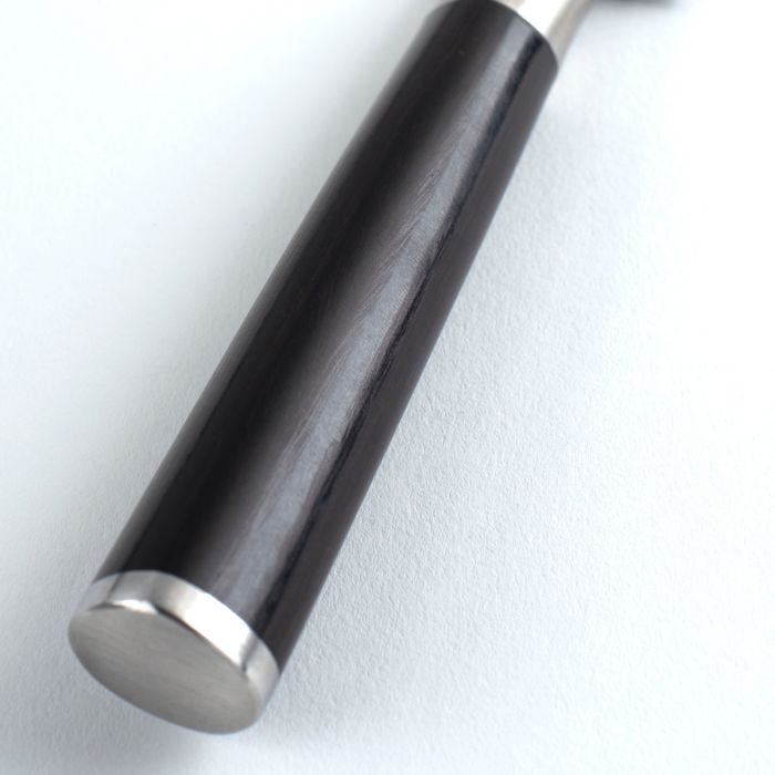 Shun Classic Paring Ebony, 3.5 inches, features a dark wooden handle with stainless-steel accents, ideal for precise tasks in the kitchen.