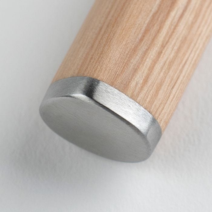 Close-up of the Shun Classic Blonde Master Utility, 6.5, showcasing its turned wooden handle with a brushed metal end cap, highlighting craftsmanship and design.