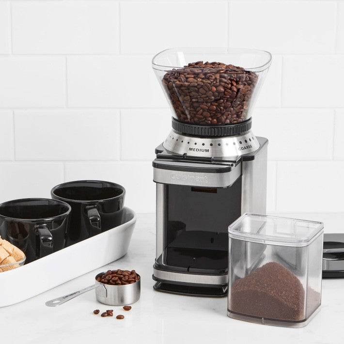 Cuisinart Supreme Grind Automatic Burr Mill with coffee beans and cups, ideal for precise grinding in Athens Cooks' curated kitchenware collection.