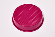 Great Jones | Patty Cake - Broccoli: Close-up of the wavy, corrugated stainless steel bottom, designed for nonstick baking and easy release of baked goods.
