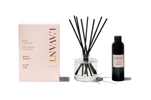 L'AVANT Collective - Reed Diffuser - Blushed Bergamot set with a pink box, glass vessel with reeds, and black refill bottle, ideal for ambient scenting.