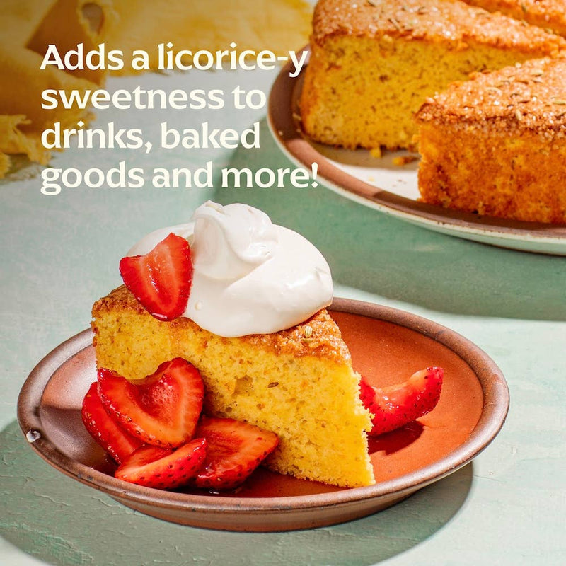 Diaspora Co. Spices - Hariyali Fennel seeds on a plate with strawberries and whipped cream, highlighting freshness and vibrant aroma from Sakariya family farm.