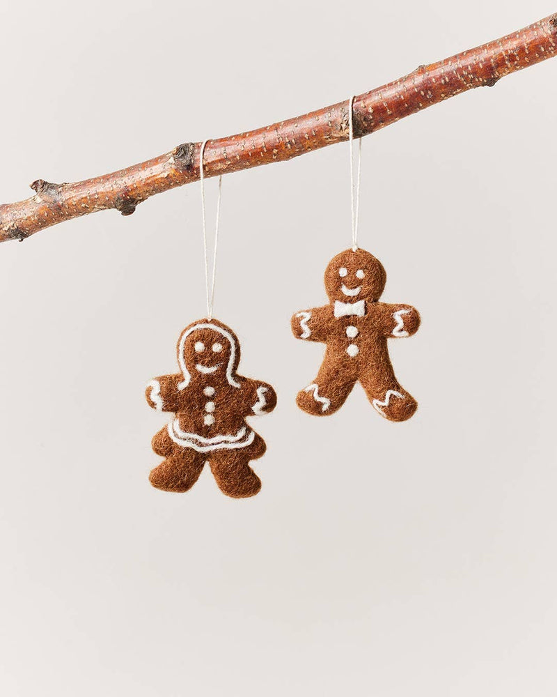 Farmhouse Pottery - Felted Gingerbread Ornament: Gentleman, handcrafted wool ornament with bow tie, hanging on twig, ideal for kitchen-themed holiday décor.