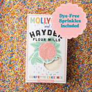 Molly Yeh x Hayden Flour Mills Confetti Cake Mix with dye-free sprinkles in a box featuring a rose graphic and visible cake mix inside.