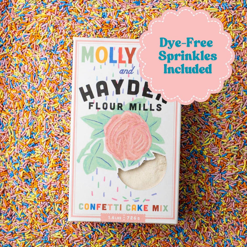 Molly Yeh x Hayden Flour Mills Confetti Cake Mix with dye-free sprinkles in a box featuring a rose graphic and visible cake mix inside.