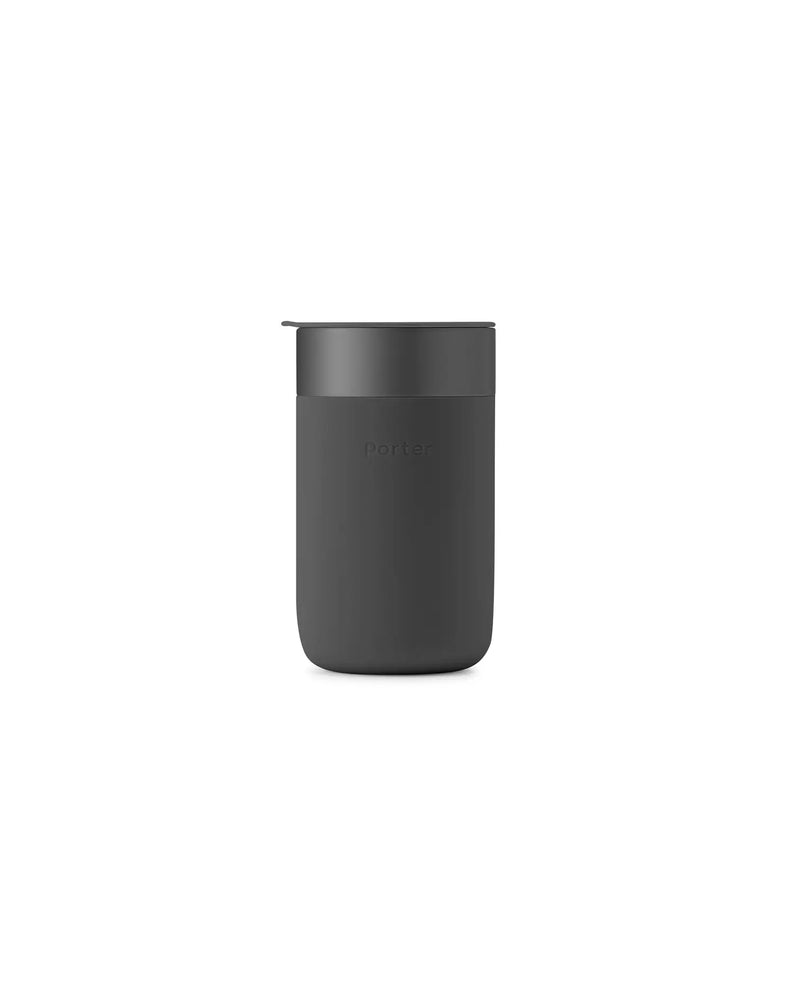 W&P Reusable Ceramic Mug: Terrazzo Blush, 16 oz, with a black lid, featuring a silicone sleeve for grip, ideal for eco-friendly coffee enthusiasts.