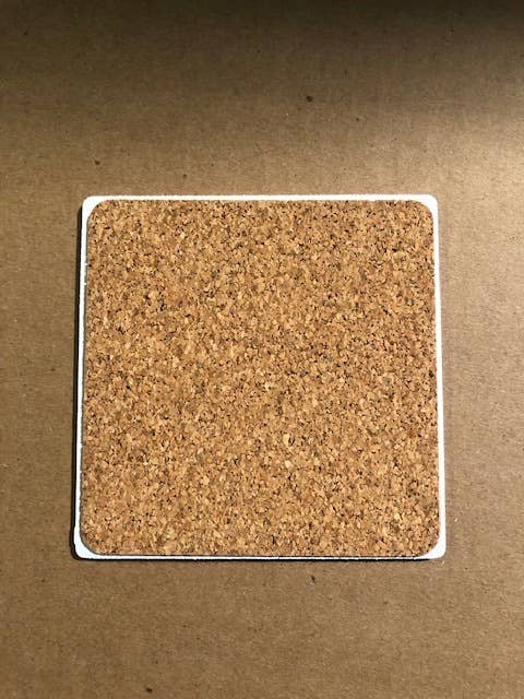 Drinks on Me - COASTER Dog Named Me: A cork coaster with a witty design, perfect for protecting surfaces and adding humor to home bar decor.