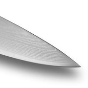 Shun Classic Chef's Blonde, 8-inch knife tip showcasing Damascus steel's wavy pattern, highlighting its sharp, multi-layered blade designed for versatile kitchen tasks.