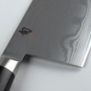 Shun | Classic Vegetable Cleaver, 7 inches, showcases a broad blade with Damascus pattern and dark handle, ideal for slicing vegetables and proteins. Handcrafted in Japan.