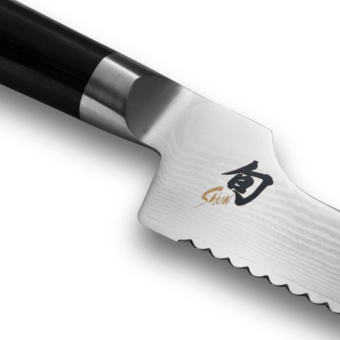 Shun Classic Offset Bread Knife, 8.25 inches, showcasing serrated blade, offset handle for knuckle clearance, and “Shun” logo, ideal for effortless bread slicing.