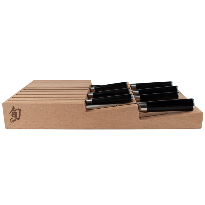 Shun | In-Drawer Knife Trays, 15 Slot: Beechwood tray with horizontal slots, holding black-handled kitchen knives, designed for compact, drawer storage of Shun cutlery.