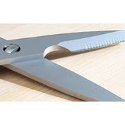 Shun Kitchen Shears, 9 inches: Premium metal scissors with Japanese 420J2 stainless steel blades, open on a wood surface, showcasing their pivot and separating blades for easy cleaning.