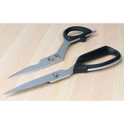 Shun Kitchen Shears, 9 inches, with metal blades and black-plastic handles, separated on a light wood surface, ideal for versatile kitchen tasks and easy cleaning.