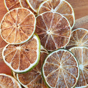 Piedmont Provisions | Dried Fruit Cocktail Garnishes - Lime: Close-up of dried citrus slices, ideal for enhancing cocktails, teas, and mocktails with elegant, flavorful garnishes.