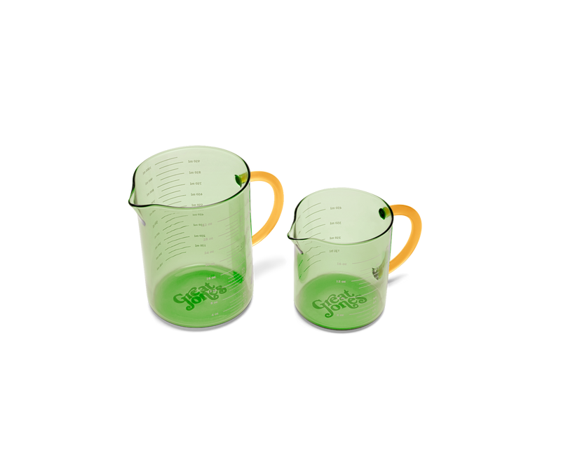 Great Jones | Beyond Measure 4-Cup - Broccoli-Butternut, a borosilicate glass measuring cup with clear measurements, ideal for precise cooking and serving.