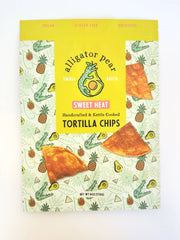 Alligator Pear Foods - Sweet Heat tortilla chips, 6oz package featuring a cartoon alligator, known for sweet pineapple and spicy cayenne flavor. Gluten-free and resealable.