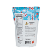 Poppy Hand-Crafted Popcorn - Peppermint Bark Popcorn pouch back with nutrition facts, ingredients, barcode, and brand story, ideal for festive gourmet snacking.