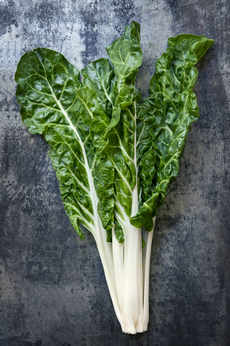 Bentley Seed Co. - Swiss Chard-Fordhook Giant 1920's: Fresh, crinkly Swiss chard leaves with creamy-white stalks, ideal for steaming, boiling, or soups.