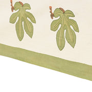 Couleur Nature - Fig Red & Green tablecloth features fig leaves on ivory, perfect for elegant dining. Crafted in France, enhancing kitchen decor with artisanal charm.
