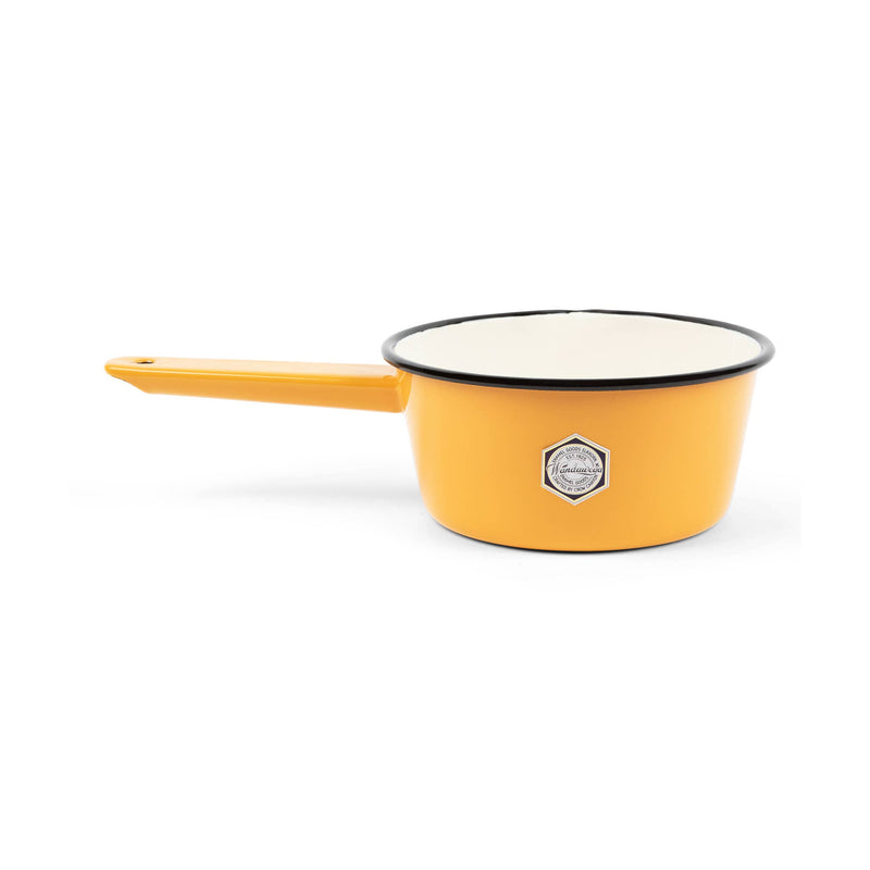 Crow Canyon Home enamelware sauce pot in mustard yellow and cream with a brown rim, ideal for enhancing culinary tasks, displayed close-up.