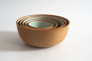 RachaelPots - Nesting Bowls Set Of Five: Light Blue, featuring a stack of hand-thrown stoneware bowls, ideal for versatile kitchen use.