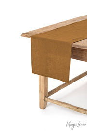 MagicLinen linen table runner on a wooden table, showcasing its soft texture and decorative appeal; perfect for enhancing table settings in any kitchen.