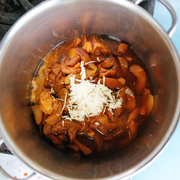 Beth's Farm Kitchen - Dutch Apple Sauce features a pot of stewing plums with grated ginger, embodying artisanal, sugar-free preserves from Athens Cooks.