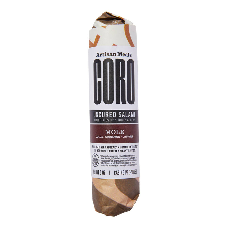 Coro Foods - Chipotle & Cocoa (Mole) Uncured Piccolo: 5-ounce salami log flavored with cocoa, cinnamon, chipotle; all-natural pork, no added nitrates, pre-peeled casing.