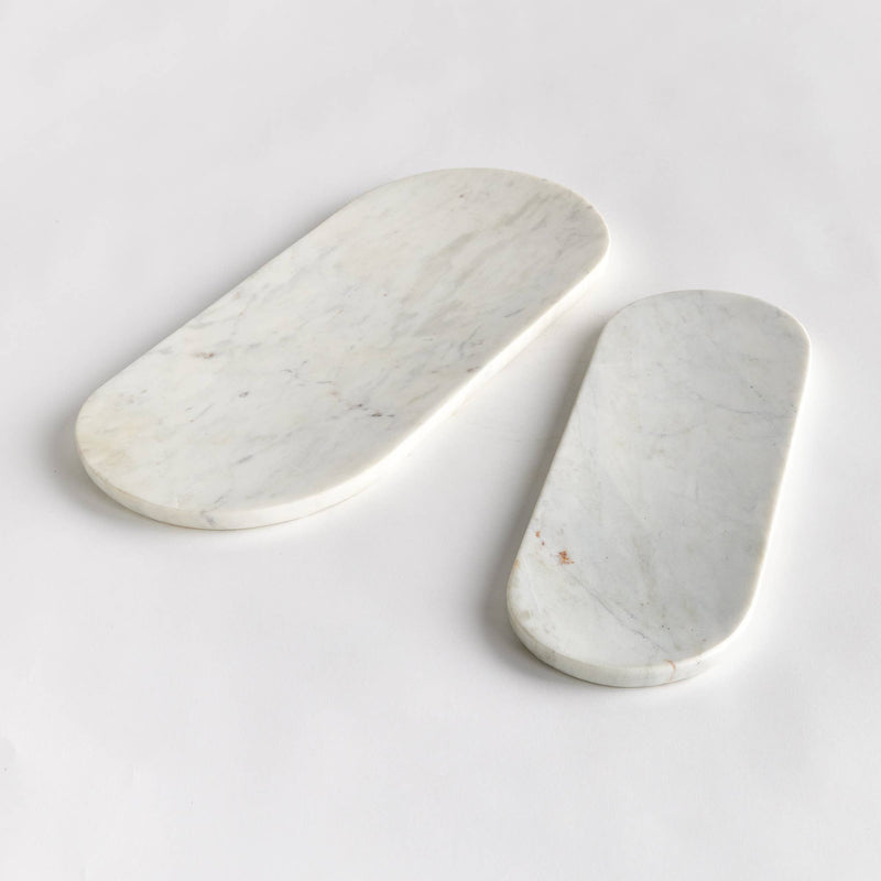 Napa Home & Garden - Amal Marble Trays: A pair of elegant oval marble trays, perfect for serving cheese and fruit, enhancing any kitchen setting.