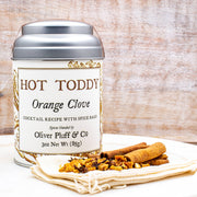 Oliver Pluff & Company - Orange Clove Hot Toddy Kit with cinnamon, cloves, orange peel, and muslin bag, ideal for crafting warm, soothing winter beverages.