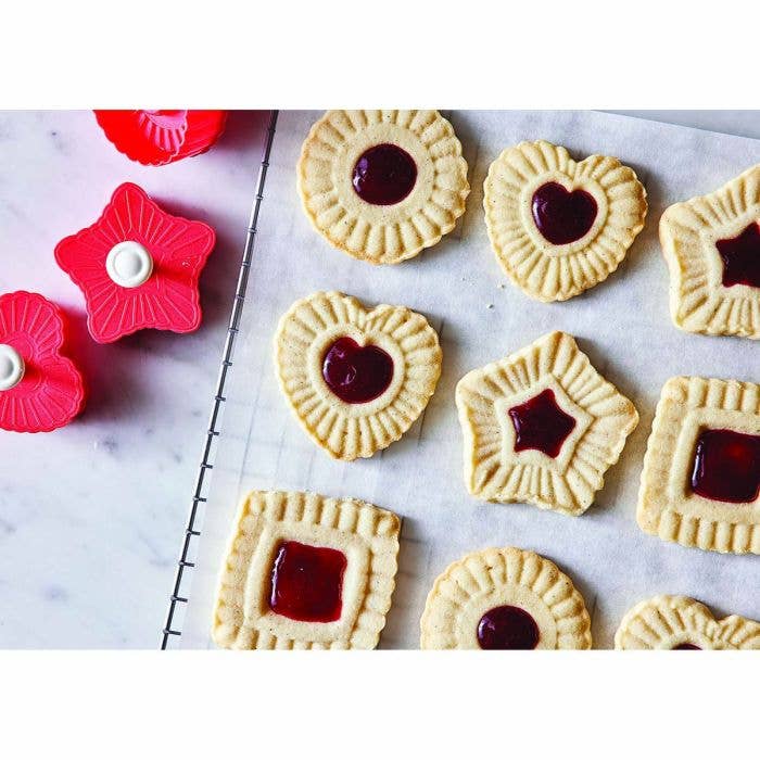HIC - Harold Import Co. - King Arthur Thumbprint Cookie Cutters 4-Piece Set, featuring heart, star, square, and circle shapes with red jam-filled centers and matching embossers.