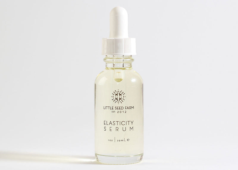 Little Seed Farm | Elasticity Serum bottle, featuring a blend of organic essential oils for enhancing skin elasticity and nourishment, designed for daily skincare routines.
