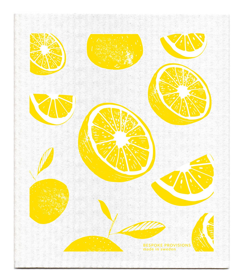 Bespoke Provisions - Lemons Swedish Dishcloth featuring yellow lemon patterns on a white surface, ideal for eco-friendly cleaning in the kitchen.