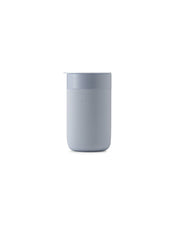 W&P - Ceramic Reusable Coffee Mug 16oz: Charcoal, featuring a white container with a soft silicone sleeve and a BPA-free press-fit lid for stylish and eco-friendly sipping.
