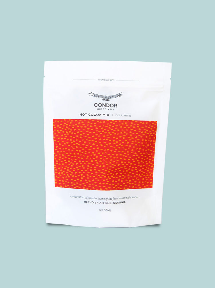 Condor | Hot Cocoa Mix in a white bag with a red design, featuring premium Ecuadorian cocoa for a rich, comforting drink. Perfect for cozy moments.