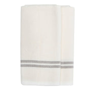 Caravan Home | Vintage Linen Ivory & Grey Towels, featuring handmade Khadhi linen with elegant gray stripes, ideal for adding chic, rustic allure to any dining setting.