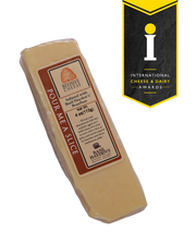 Beehive Cheese Co. LLC | Pour Me A Slice - 4 oz Wedge: Aged cheddar infused with Basil Hayden Bourbon, showcasing unique packaging with a label, ideal for culinary exploration.