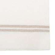Close-up of Caravan Home's Vintage Linen Ivory & Grey Towels, featuring handmade Khadhi linen with beige stripes, ideal for enhancing rustic or modern dining aesthetics.